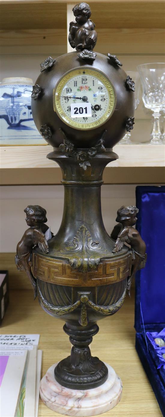 A 19th century French bronzed spelter mantel timepiece, 28in.